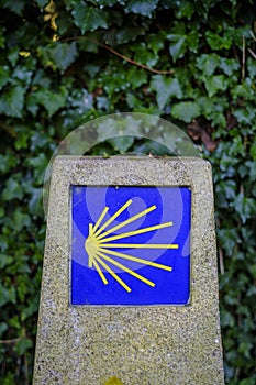Granite post with the yellow icon on a blue background.