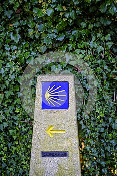 Granite post with the yellow icon on a blue background.