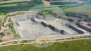 Granite quarry. Extraction of granite. Open cast mine. Stone Quarrying - Aerial view