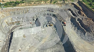 Granite quarry. Extraction of granite. Open cast mine. Stone Quarrying - Aerial view