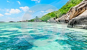 Granite rocks and coral reef in world famous Anse Source d\'Argent beach