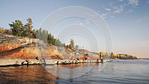 Granite rocks with woods of coastline and islands in North Europe, Baltic sea, gulf of Finland. Clean nordic nature in autumn