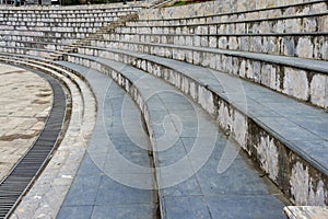 Granite stairs, abstract steps, city stairs, a wide concrete staircase, which can often be seen in amphitheaters, wide stone stair