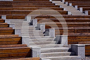 granite stairs between empty wooden benches.