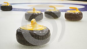 Granite stones for curling on white ice close-up.Winter sport, team game.Curling Club