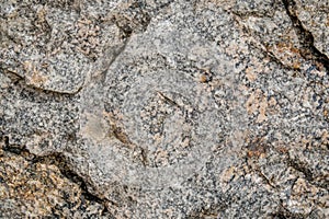 A granite texture background showcases a rugged, speckled surface with natural variations in color and pattern photo