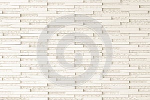 Granite tiled wall detailed pattern texture background in natural light creme beige color