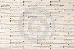 Granite tiled wall detailed pattern texture background in natural light creme beige color