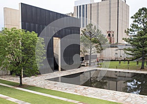 Granite walkway, reflective pool with 9:01AM wall and Field of Empty Chairs, Oklahoma City Memorial