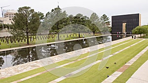 Granite walkway, reflective pool with 9:03AM wall and Field of Empty Chairs, Oklahoma City Memorial