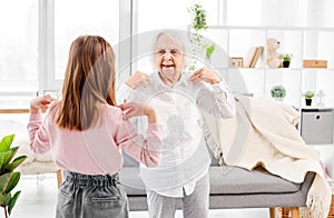 Granmother and granddaughter exercising