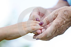 Granmother and niece holding hands