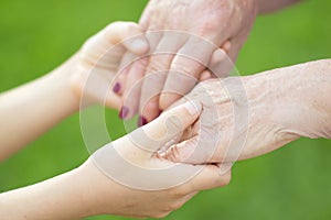 Granmother and niece holding hands