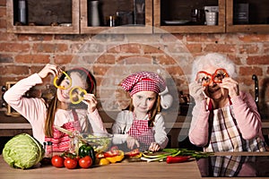 Granny with children at home kitchen