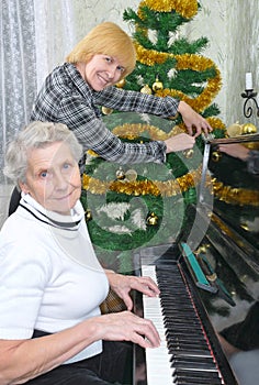 Granny and daughter prepare to Christmas