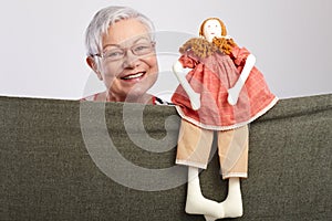 Granny presenting a puppet show