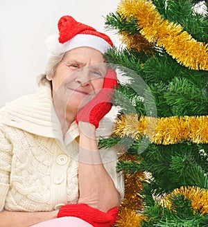Granny in red Santa Claus hat and red mittens