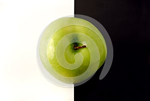 Granny Smith apple on artistic background
