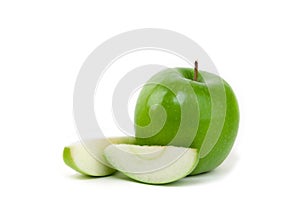 Granny smith apple and slices on white background