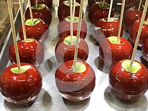 Granny Smith red candy apples on display