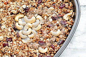 Granola in a baking dish, cashew in the shape of heart. Food concept. Close-up