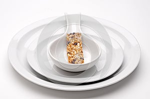 Granola bar on bland white serving dishes