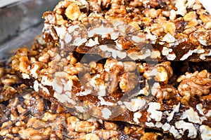 Granola bar in a bowl for sale. Healthy sweet dessert snack. Cereal granola bar with nuts