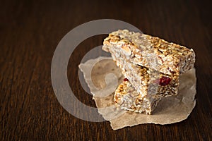 Granola bar or energy bar on brown background