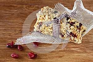 Granola bar or energy bar on wooden background