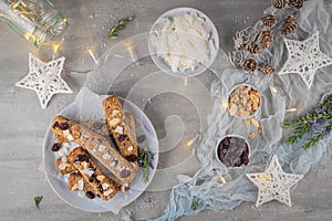 Granola bar. Healthy snack. Cereal granola bar with nuts, fruit, coconut and cranberries on a christmas table. Top view