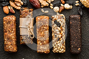 Granola bars with nuts on wooden table