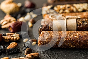Granola bars with nuts on wooden table