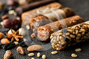 Granola bars with nuts on wooden table