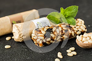 Granola bars with nuts on wooden table