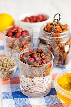 Granola with berries and yogurt in glasses