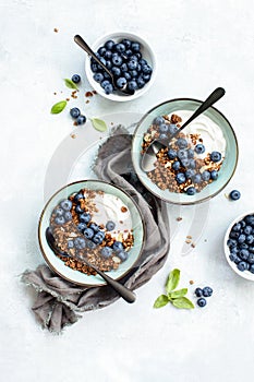 Granola and blueberry breakfast with plain yogurt, top down view