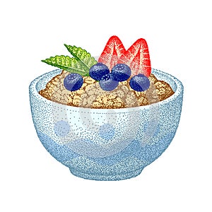 Granola in bowl with strawberries, blueberries, mint leaves. Oatmeal healthy breakfast, oat grain porridge. Cereal food