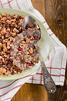 Granola in a bowl wooden background