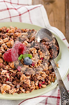 Granola in a bowl wooden background