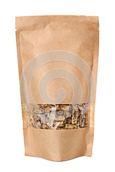 Granola breakfast in kraft paper bag isolated on white background. muesli. healthy food. fitness food