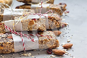 Granola energy bars with figs, oatmeal, almond, cranberry, chia and sunflower seeds, healthy snack, copy space