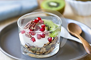 Granola with Greek yogurt ,Kiwi and Pomegranate photo