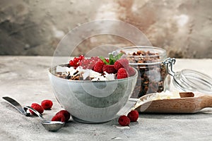 granola healthy breakfast with natural yogurt, muesli and berries