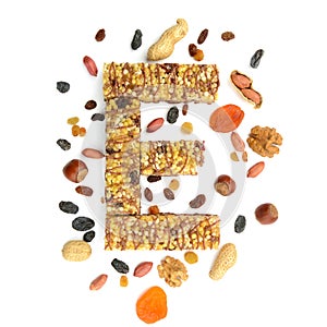 Granola muesli, cereal bar in form of letter E and its ingredi