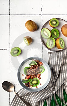 Granola, muesli with kiwi fruit and yogurt