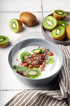 Granola, muesli with kiwi fruit and yogurt