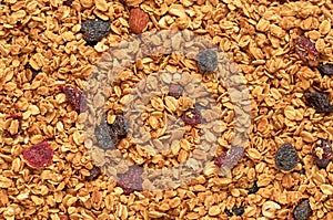 Granola with nuts and dried fruits texture background photo