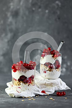 Granola Parfait with Yogurt, oat granola, fresh berries in glass