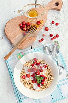 Granola with yoghurt and wild strawberries