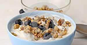 Granola with yogurt and blueberries.